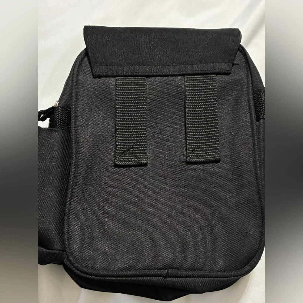 Petit Crossbody with Paris Bling. 3 Zippered pockets. 32” + detachable strap